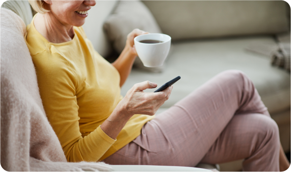 Person enjoying coffee while completing intake form